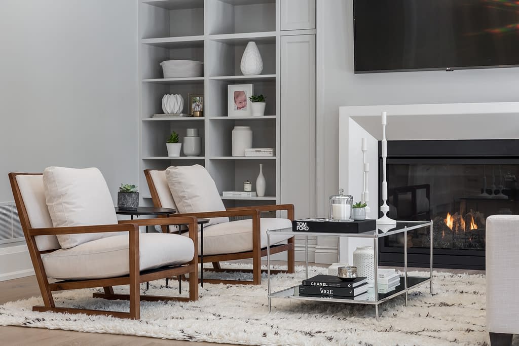 Real Estate 5 by Snapscene Photography Modern living area with book cases and warm fire place