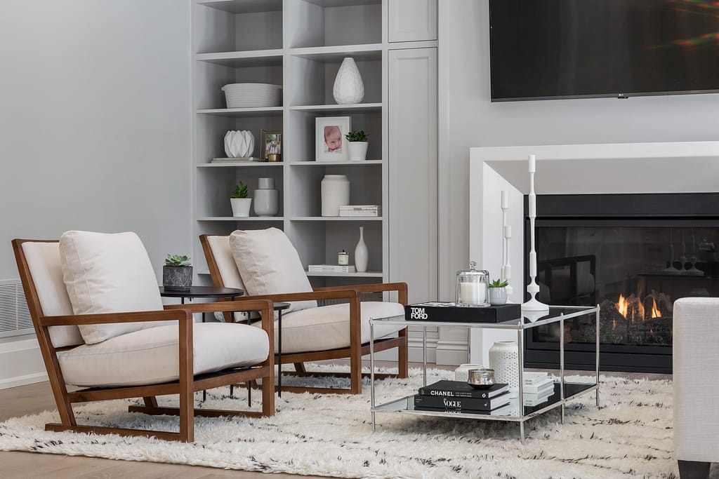 Real Estate 5 by Snapscene Photography Modern living area with book cases and warm fire place