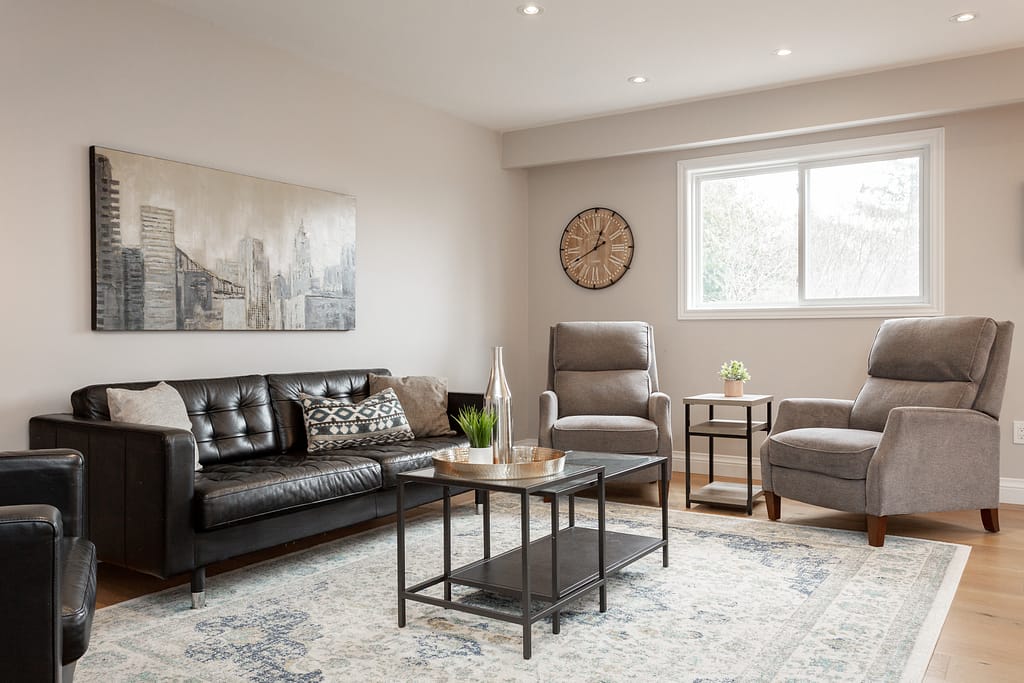 Real Estate 3 by Snapscene Photography Cozy living area with sofas and arm chairs