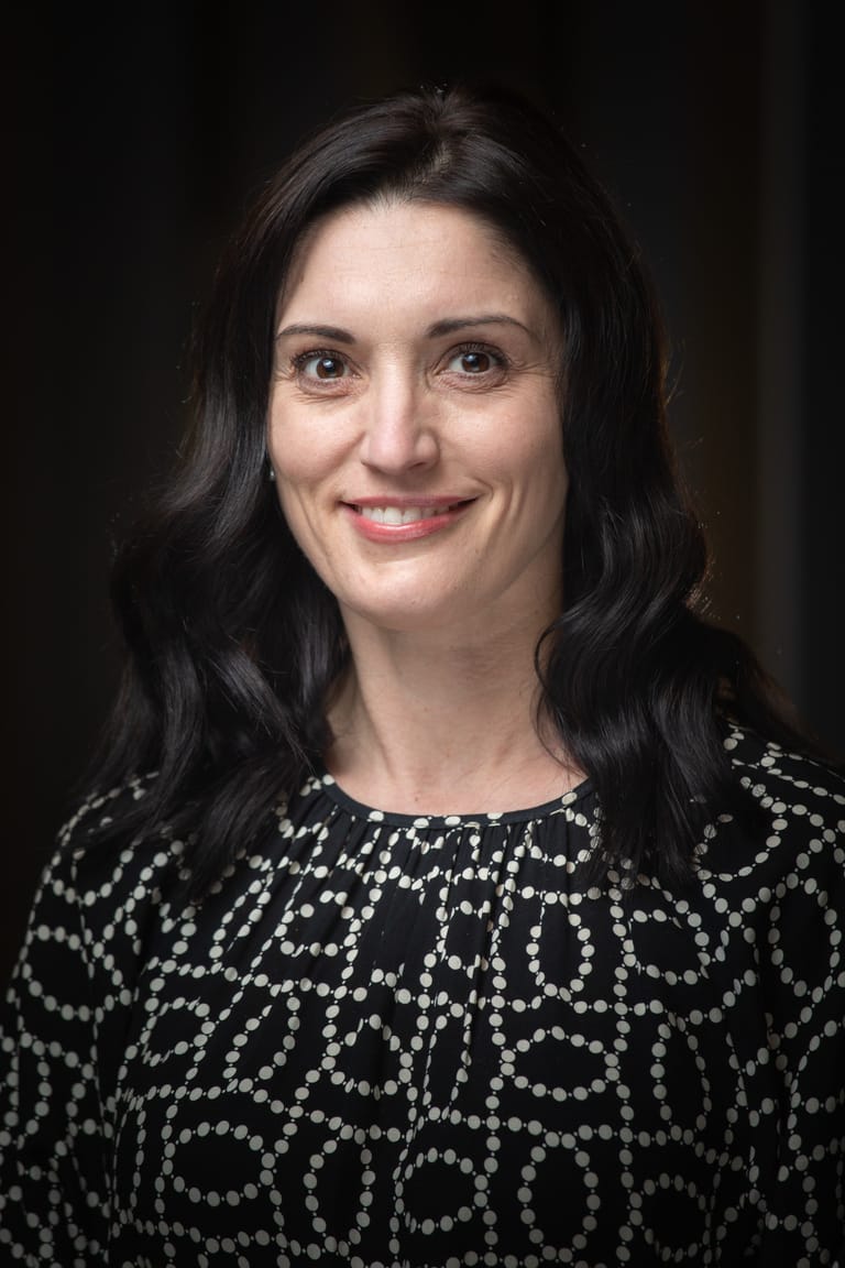 Headshots and Personal Branding 1 by Snapscene Photography formal headshot of a lady on a dark background