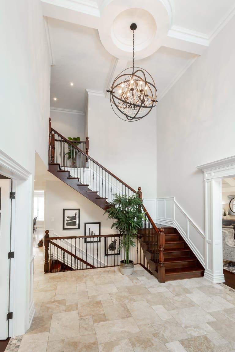 The grand foyer with chandelier at 1009 Lakeshore Road West