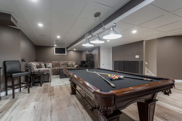 A basement rec room with a pool table at 75 davis street